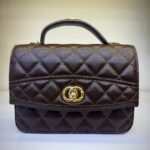 Elegant Dark Brown Quilted Grain Leather Top-Handle Handbag with Gold Interlocking Clasp